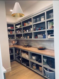 a kitchen with lots of shelves filled with food