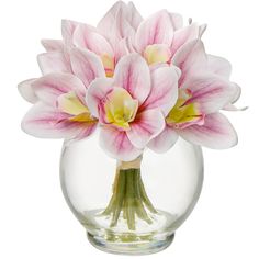 a glass vase filled with pink and white flowers