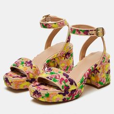 Elevate your style with these vibrant ankle strap platform heeled sandals featuring intricate floral embroidery in a myriad of colors. Perfect for making a statement with every step you take. Color: Multicolor Heel Type: Block heel Heel Height: 2.76'' / 70 mm approx Platform Height: 1.38'' / 35 mm approx Product measurements were taken using size 8. Please note that measurements may vary by size. Toe: Open square toe Floral embroidered design Adjustable buckled ankle strap design Handcrafted US Summer Floral Embroidered Heels, Spring Multicolor Chunky Platform Heels, Floral Platform Heels, Spring T-strap Sandals With Platform And Open Heel, Summer Multicolor Floral Print Heels, Floral Heels, Platform Block Heels, Platform Sandals Heels, Strap Design