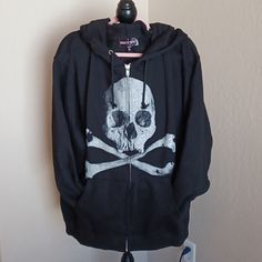 Dollskill Trickz N Treatz Black Long-Sleeved Zip Hoodie With Skull On Front 1x This Is Very Oversized Im 2x And This 1x Is Big On Me This Is Just My Opion Alternative Style Skull Print Hoodie, Alternative Long Sleeve Hoodie With Skull Print, Edgy Skull Print Hoodie For Halloween, Black Skull Hoodie For Fall, Edgy Skull Print Sweatshirt For Winter, Halloween Cotton Outerwear With Skull Print, Black Alternative Style Sweatshirt With Skull Print, Black Skull Print Alternative Sweatshirt, Cotton Hoodie With Skull Print