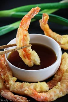 shrimp sticks with dipping sauce in a bowl