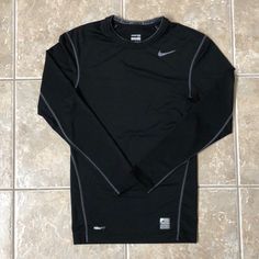 Never Worn Nike Pro Dri-Fit Shirt. Size Small, Would Fit A Petite Woman Or Child. Long Sleeve Athletic Shirt Outfit, Nike Drifit Polo, Sporty Fitted Black Shirt, Black Fitted Sporty Shirt, Nike Fitted Sports Shirt, Nike Fitted Shirt For Sports, Fitted Nike Sports Shirt, Fitted Nike Shirt For Sports, Nike Fitted Long Sleeve Tops