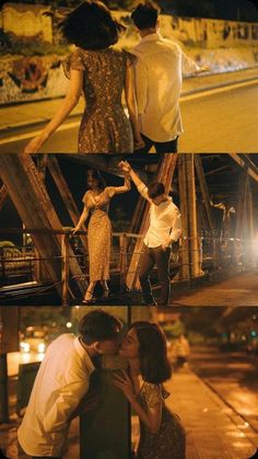 three people standing on top of a wooden bridge at night and one person kissing the other