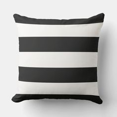 a black and white pillow with horizontal stripes