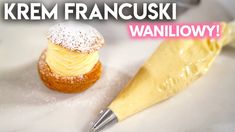 there is a small pastry with icing on it and the words krem francuski