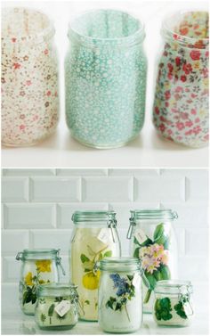 four different jars with flowers in them