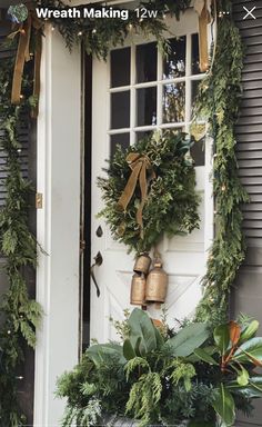 a potted plant sitting in front of a door with bells hanging from it's side