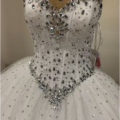 a white dress with silver sequins on it