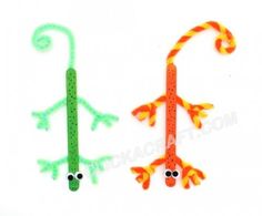 two different colored lizards are shown in the shape of letters and numbers on white paper