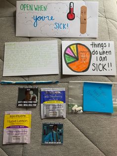 several pieces of paper and stickers on the floor next to a sign that says, open when you're sick