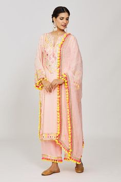 Pink long kurta with sequin, mirror, thread embroidery in geometric pattern. Paired with palazzo and dupatta.
Components: 3
Pattern: Embroidery
Type Of Work: Mirror, thread, sequin, geometric
Neckline: Notched
Sleeve Type: Full sleeves
Fabric: Kurta: Viscose, Palazzo: Linen Satin, Dupatta: Chiffon
Color: Pink
Other Details: 
Pompom and tassel border
Sheer dupatta
Embroidery on palazzo hem
Occasion: Sangeet - Aza Fashions Satin Dupatta, Gopi Vaid, Dupatta Embroidery, Sheer Dupatta, Embroidery Mirror, Pink Kurta, Long Kurta, Palazzo Set, Pattern Embroidery