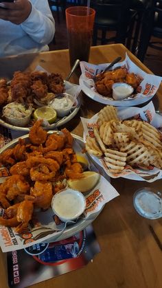 a table topped with plates of food and drinks