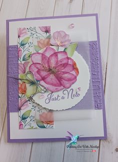 a close up of a card with flowers on it and the words just a note