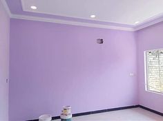 an empty room painted in purple and white