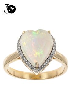 Pre-Owned 2.38ct Heart Shaped Cabochon Ethiopian Opal And 0.11ctw Round White Diamond 10k Yellow Gold Ring. Measures Approximately 0.48"L x 0.53"W. .  This product may be a customer return, vendor sample, or on-air display and is not in its originally manufactured condition.  It may not be new.  In some instances, these items are repackaged by JTV. Yellow Gold Ring, Beads And Wire, Yellow Gold Rings, Jewelry Trends, Ethiopian Opal, Metal Jewelry, White Diamond, Pendant Jewelry, Gold Ring