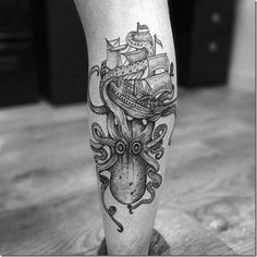 an octopus and ship tattoo on the leg