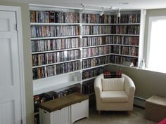 a room filled with lots of different types of dvd's on the walls and shelves