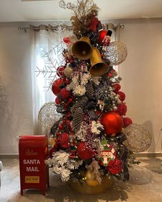 a christmas tree decorated with ornaments and bells