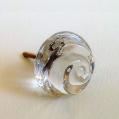 a glass door knob on a white surface