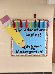 a bulletin board that says the adventure begins welcome to kindergarten