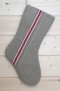 a gray stocking with red and white stripes