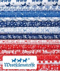 christmas fabric with reindeers and snowflakes in red, white, and blue