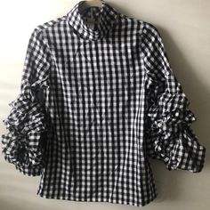 Black And White Checkered Blouse With Awesome Ruffled / Puffy Sleeves. The Neck Is Awesome Too - Cutout Turtleneck (Hard To Show In Pictures But It’s Sexy And Cool). Great Top For Day, Night And All Occasions! Chic Fitted Plaid Top, Chic Plaid Tops For Office, Chic Plaid Tops For Day Out, Plaid Blouse For Brunch, Plaid Blouse For Spring Workwear, Plaid Blouse For Workwear In Spring, Trendy Plaid Tops For Brunch, Plaid Tops For Fall Brunch, Plaid Tops For Brunch In Fall