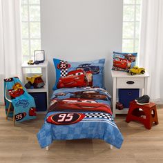 a bedroom with cars bedding and toys