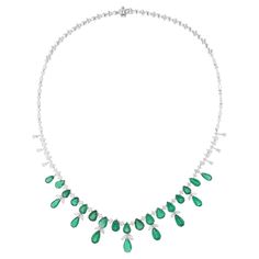 Experience the epitome of sophistication and allure with this breathtaking pear Zambian emerald gemstone necklace, adorned with round and pear diamonds, set in lustrous 18 karat white gold. Handcrafted with meticulous attention to detail, this exquisite piece of jewelry exudes timeless elegance and unmatched charm. Item Code :- SEN-51211 Gross Wt. :- 28.24 gm 18k White Gold Wt. :- 23.53 gm Natural Diamond Wt. :- 5.89 Ct. ( AVERAGE DIAMOND CLARITY SI1-SI2 & COLOR H-I ) Emerald Wt. :- 17.68 Ct. Necklace Length :- 16 Inches Long ✦ Sizing ..................... We can adjust most items to fit your sizing preferences. Most items can be made to any size and length. Please leave a note at checkout or contact us via 1stDibs conversation. Even after purchasing the item, you can still ask us to adjus Elegant Green Pear-shaped Diamond Necklace, Elegant Pear-shaped Emerald Necklaces, Elegant Pear-shaped Emerald Necklace, Elegant Green Pear-shaped Necklace, Fine Jewelry Emerald Pear Necklace, Pear Shaped Emerald Necklace In Fine Jewelry, Green Diamond Drop Necklaces, Elegant Teardrop Emerald And Diamond Necklace, Pear-shaped Emerald Necklace