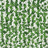 green leaves are arranged in the shape of a mosaic pattern on a white wallpaper