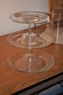 two clear plates sitting on top of a wooden table