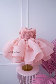 This beautiful blush tutu first birthday baby girl dress is the perfect choice for any little princess's special day. Crafted from high-quality tulle fabric, this puffy dress is designed to provide a comfortable and stylish fit for your little one. Whether she's attending a first birthday party or serving as a flower girl, this dress is sure to make a statement. The delicate floral embellishments and elegant design create a stunning and sophisticated look that will have everyone talking. Your li Elegant Pink Tutu Dress For Wedding, Elegant Ruffled Princess Dress For Birthday, Elegant Ruffled Baptism Dress For Birthday, Pink Ruffled Princess Dress For First Birthday, Elegant Pink Tutu Dress For First Birthday, Pink Organza Tutu Dress For Baptism, Princess Organza Dress For First Birthday, Pink Ruffled Princess Dress For Baptism, Princess Style Organza Dress For First Birthday