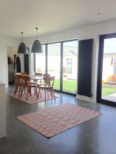 a living room filled with furniture next to a sliding glass door that leads to a patio