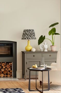 a living room filled with furniture and a fire place