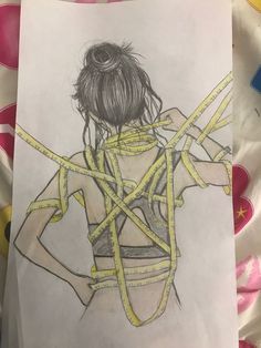 a drawing of a woman tied up to her back with yellow cords on her shoulders