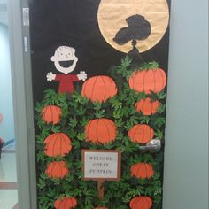 a door decorated with pumpkins and a welcome sign