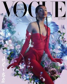 a woman in a red dress on the cover of a magazine with flowers and butterflies around her