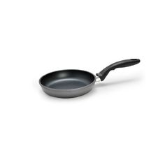 an empty frying pan on a white background