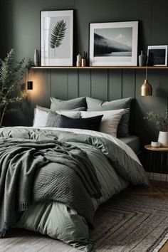 a bedroom with green walls and grey bedding