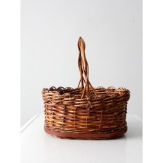 a wicker basket sitting on top of a white table