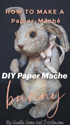 a white rabbit statue with the words how to make a paper mache bunny