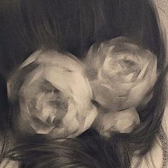 a pencil drawing of a woman's head with three roses on her forehead and long hair