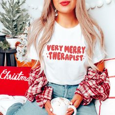 Very Merry Therapist Jersey T-Shirt | Speech Shirt | SLP T-Shirt | Speech Therapy Christmas | Therapist Gift | Holiday | OT Shirt | PT Shirt This classic unisex jersey short sleeve tee is perfect for the holiday season. It's made from soft cotton (heather colors contain polyester). This t-shirt is unisex size, please refer to the size chart to ensure you are selecting the best size. This garment is direct-to-garment printed; to maintain quality of the print, it is best to wash in cold water on d Christmas Vacation Quotes, Heather Storm, Santa Tee, Classic Christmas Movies, Happy Birthday Jesus, Tee Tree, Jesus Tees, Movie Quotes Funny, Holiday Wear