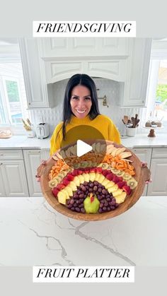 a woman holding a platter full of fruit and vegetables with the words friends giving