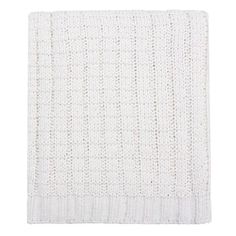 a white knitted blanket on a white background