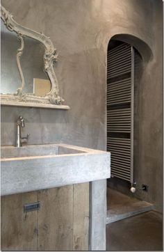 a bathroom with a sink, mirror and towel rack