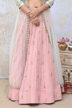 Pink spun silk lehenga with sequins embroidery. Comes with a powder blue raw silk blouse and a net jacket.
Components: 3
Pattern: Embroidered
Type Of Work: Sequins
Neckline: Round
Sleeve Type: Jacket : Full, Blouse : Sleeveless
Fabric: Lehenga : Spun silk, Blouse : Raw silk, Jacket : Net
Color: Pink
Other Details: 
Lehenga length : 44 inches
Closure : Blouse - Back hooks and potli buttons with loop detailing
Occasion: Destination Wedding - Aza Fashions Raw Silk Sets With Sheer Dupatta, Floor-length Sets With Dori Work, Eid Festival Long Skirt Set With Dupatta, Eid Festival Set With Dupatta And Long Skirt, Wedding Lehenga With Dori Work, Unstitched Art Silk Gown, Chanderi Gown For Eid, Festive Set With Sheer Dupatta And Long Skirt, Bollywood Gown With Dori Work