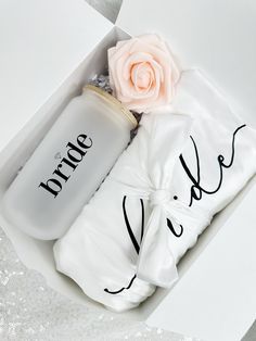 the bride and groom gift set is in a white box with a rose on top