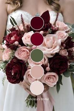 a bridal bouquet with burgundy, pink and green flowers in shades of red on the bride's wedding day