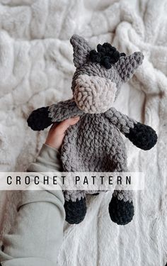 a hand holding a crocheted stuffed animal in it's right hand with the text, crochet pattern